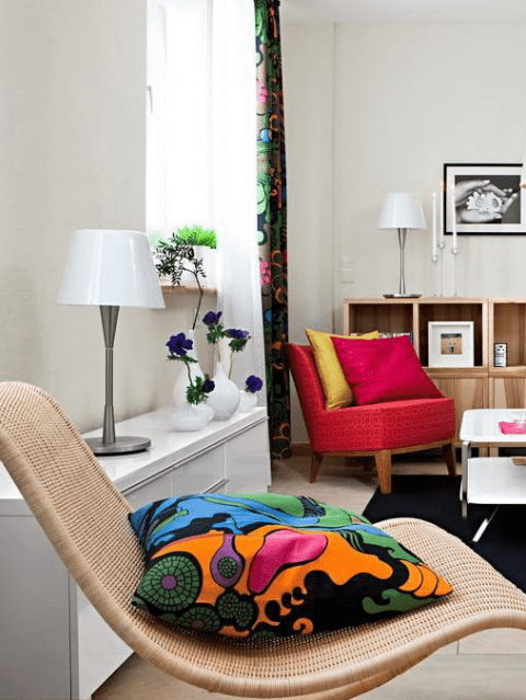 Bold printed textiles and upholstery make the room look vivacious and inviting