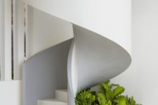 05 Under the sculptural staircase you’ll see fresh greenery growing