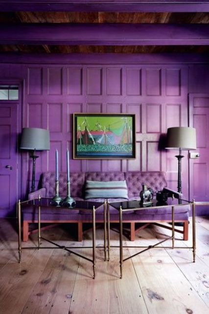 a violet paneled wall with a matching diamond upholstery sofa look wow