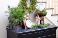 05 evergreens, a wicker deer and ornaments in a cloche look cute, rustic and vintage