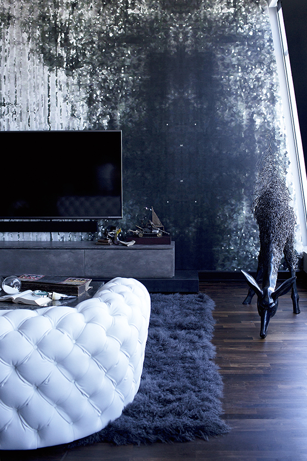 A animal sculpture and a faux fur rug add eye-catchiness and comfort to the space