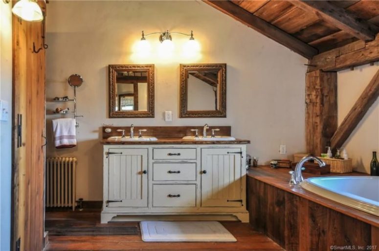 vintage looking bathroom vanity The bathroom is clad with wood, even the bathtub and there's a vintage vanity