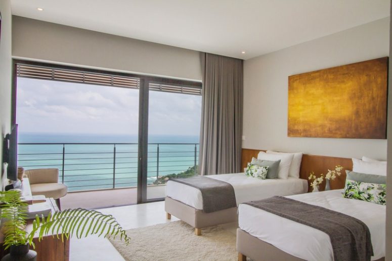The home is done in white, neutral shades with lots of teak wood