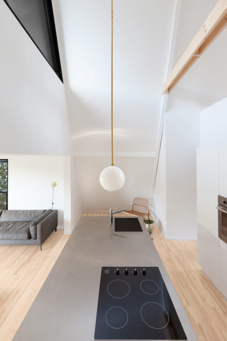 You can also see a cozy sitting nook with a wicker chair that was created to get maximum of the complex shape of the house You can also see a cozy sitting nook with a wicker chair that was created to get maximum of the complex shape of the house