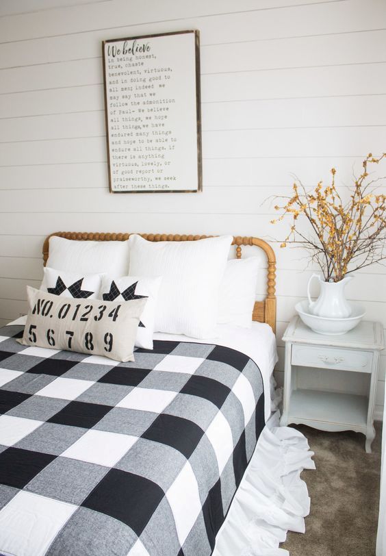 a farmhouse styled bedroom with a buffalo check bedding set that highlights the decor