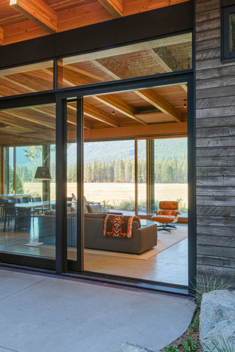 Extensive glazing helps the indoor spaces merge with the terraces outdoors that seem to extend the rooms outside