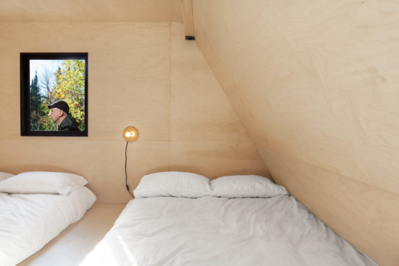platform beds with storage inside The kids' room features much plywood, a platform with two beds and storage space inside