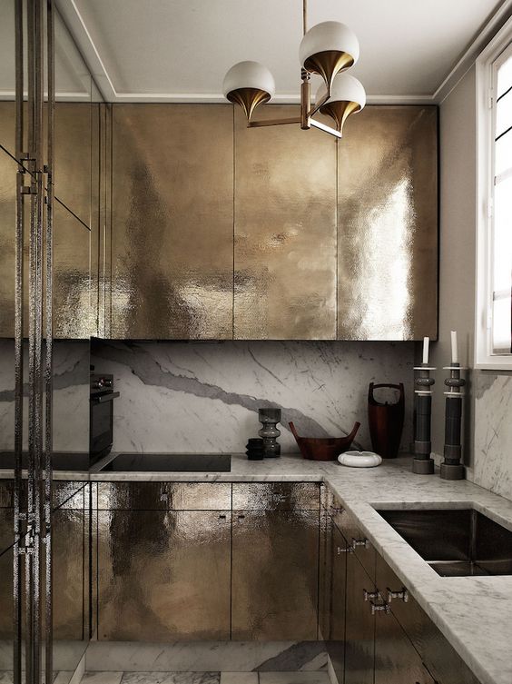 though the kitchen is metallic, there's only one chandelier and therefore not enough light