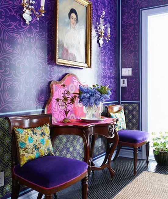 an ultra violet printed statement wall and matching upholstered chairs