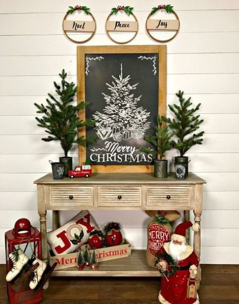 Christmas toys, evergreen trees, a chalkboard sign and red touches make up a vintage look