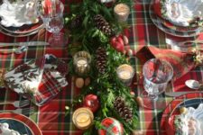 10 a plaid tablecloth, plaid napkins and plates and even plaid ornaments refreshed with evergreens