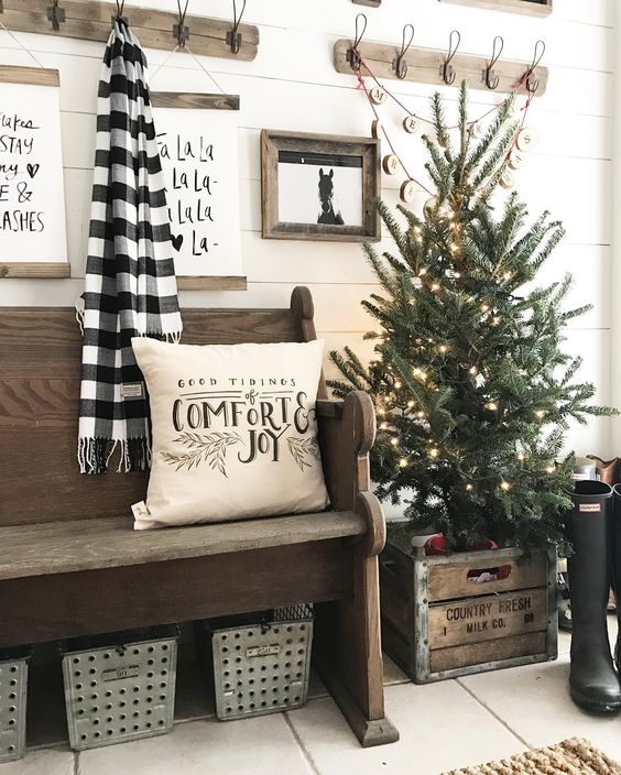 a lit up tree in a crate will add an industrial feel to your farmhouse entryway
