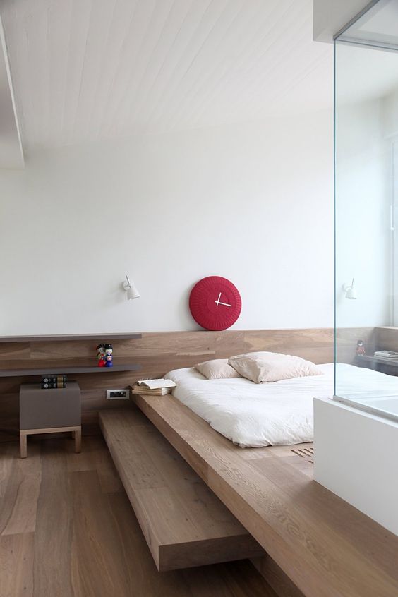a platform bed is traditional for Japanese interiors, and nightstands are Scandi-like though colored
