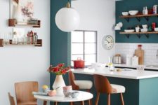 11 a teal kitchen with white and natural wood touches is perfectly retro styled