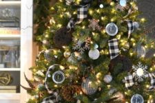 12 a black and white Christmas tree with pinecones, lights and buffalo check ornaments and garlands