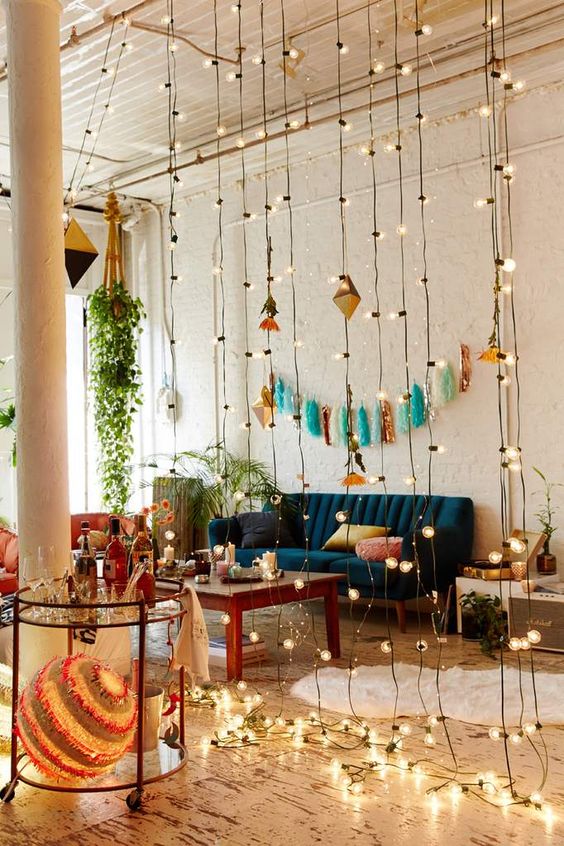a curtain of string lights can be a nice idea to add some light to the interior and divide it into zones
