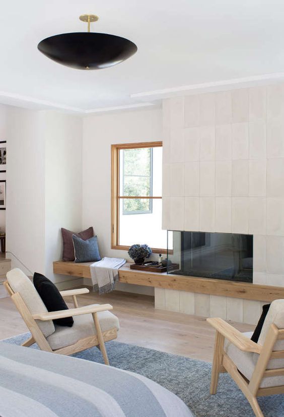 light wood chairs with grey upholstery and a wooden windowsill bench