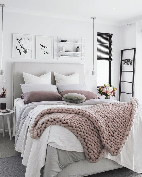 white and grey bedding with blush and dusty pink touches