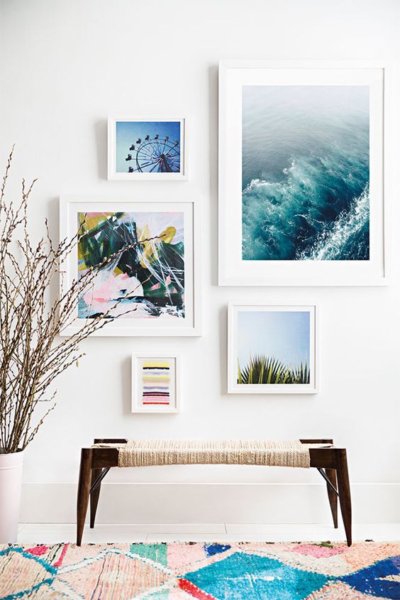 a breezy gallery wall with pics inspired by the vacations will make your entryway relaxing