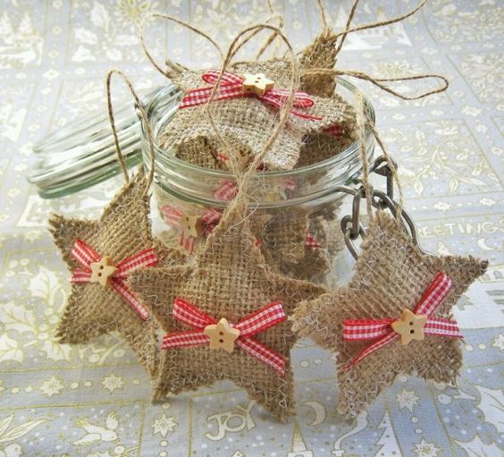 little burlap star ornaments with plaid bows and star buttons for a cute rustic tree