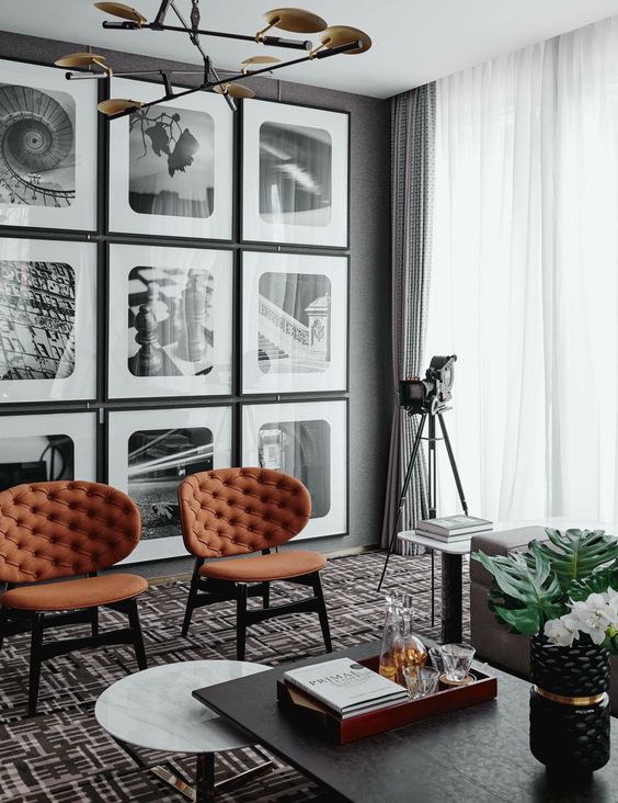 a regular gallery wall in black and white adds style and a retro feel to the space