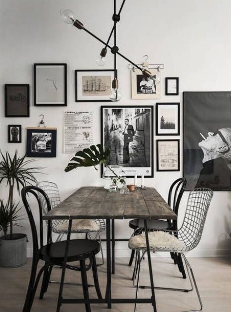 a stylish black and white retro-inspired gallery wall for a dining space