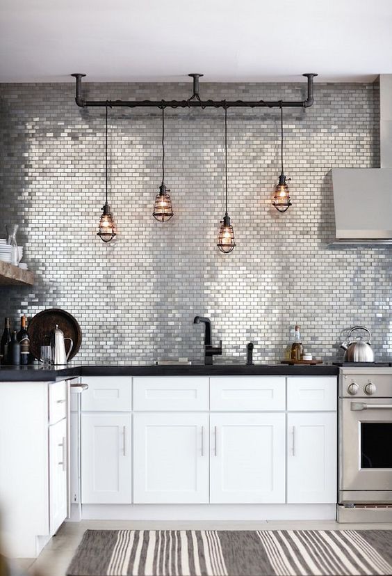 shiny metallic tiles that take a whole wall are ideal to add a glam feel