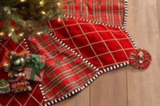 20 a red velvet and plaid Christmas tree skirt is all you need for a chic and cozy look