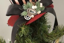 20 top the tree with a steampunk striped top hat with a ribbon bow and some berries