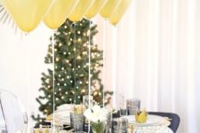 22 gold balloons centerpiece for a cool tablescape in black and gold