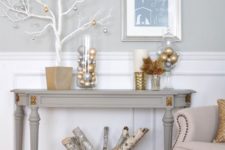 22 ornaments in jars, a white tree with metallic ornaments and a metallic basket with branches