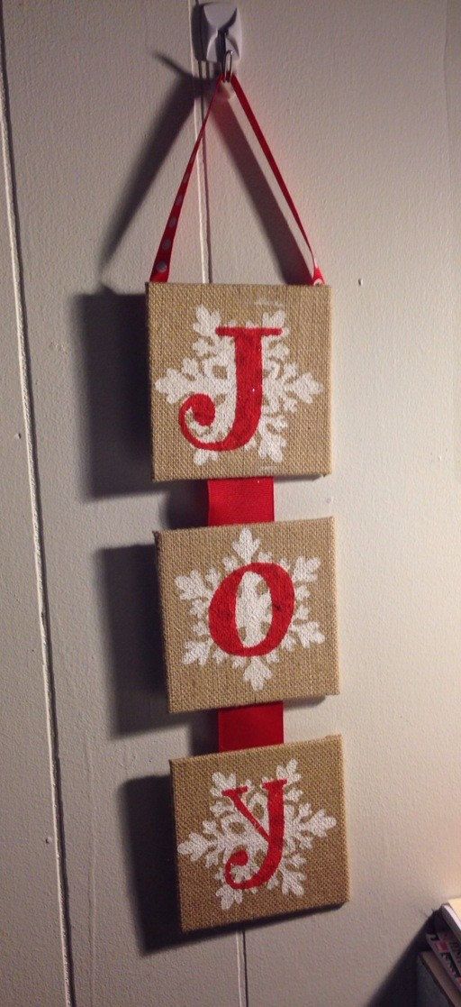 a JOY burlap sign with snowflakes and red letters will decorate any door or mantel