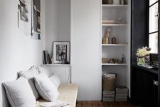 24 simple white cabinets and open shelves and a light-colored woven bench