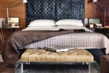 24 warm wood walls contrast a black leather woven headboard that brings texture in