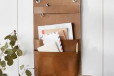 25 a brown leather wall storage piece for an entryway – put your keys and mail here