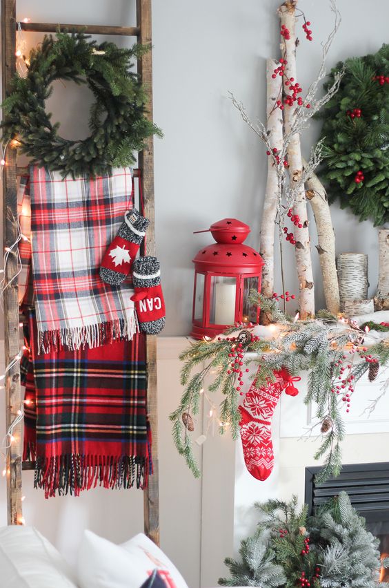 some plaid flannels hanging on a ladder for a cozy rustic Christmas feel