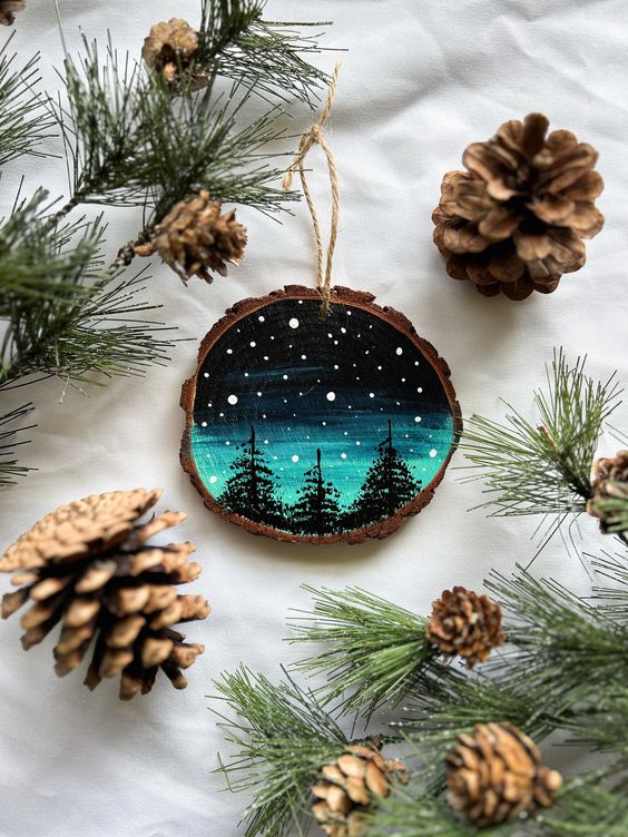 a beautiful Christmas tree slice ornament with starry night painted is absolutely adorable