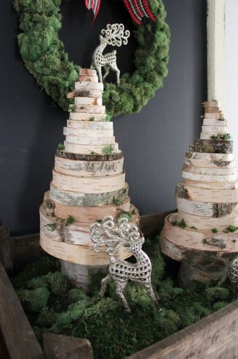 such wood slice Christmas trees can be DIYed easily and displayed with moss is a great holiday composition you can make