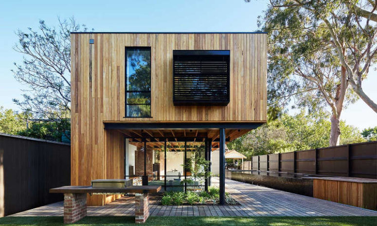 Park House is an industrial home of two storeys that features a deck and a long narrow pool outside