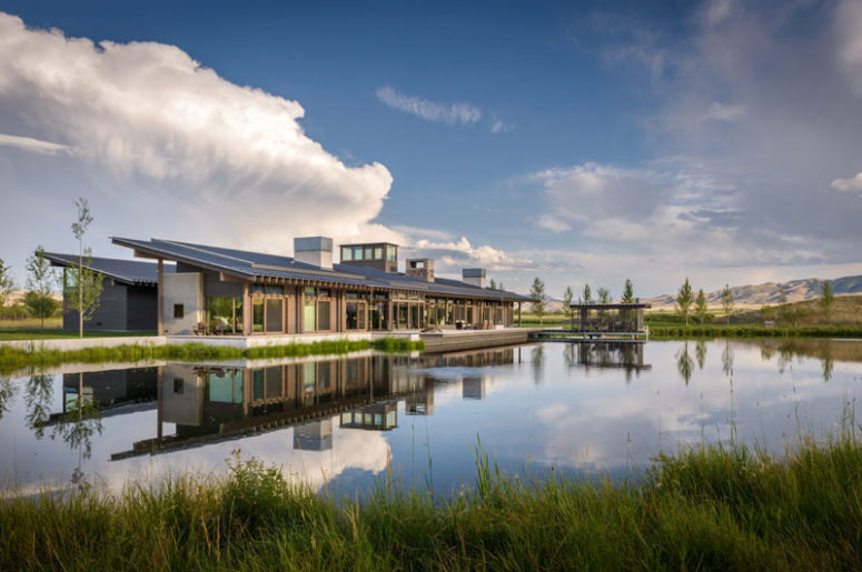 This modern ranch home features perfect landscape blending and catches peaceful views of the nature around