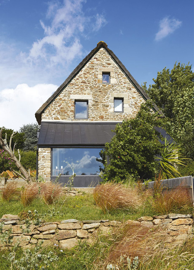 This old seaside home got a modern renovation and only its exterior reminds that it was an old dwelling