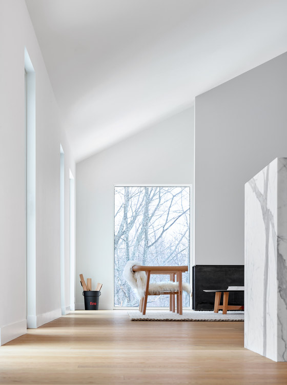 open kitchen layout in a modern chalet The main space in the home is an open layout of a kitchen and a living room