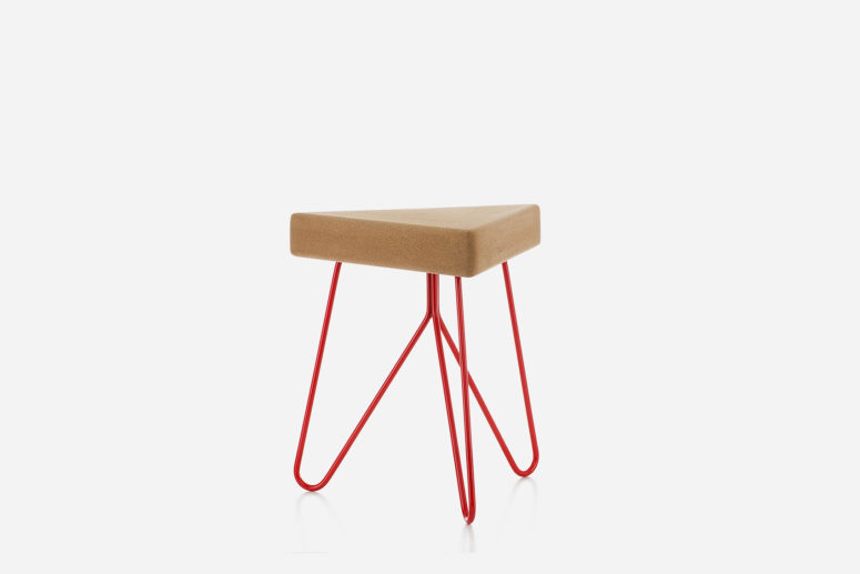 The triangular seat is made of cork, and the colored powder coated steel legs hold it in a stable way The triangular seat is made of cork, and the colored powder coated steel legs hold it in a stable way