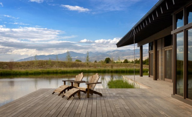 outdoor pond by the house There are two man-made ponds full of trout and a deck over them to enjoy the sunlight