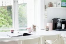 02 a kitchen counter is continued into a windowsill and is used as a breakfast bar