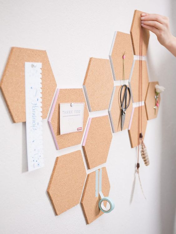 cork hexagons with pastel edges cna be used to create a customized pinboard