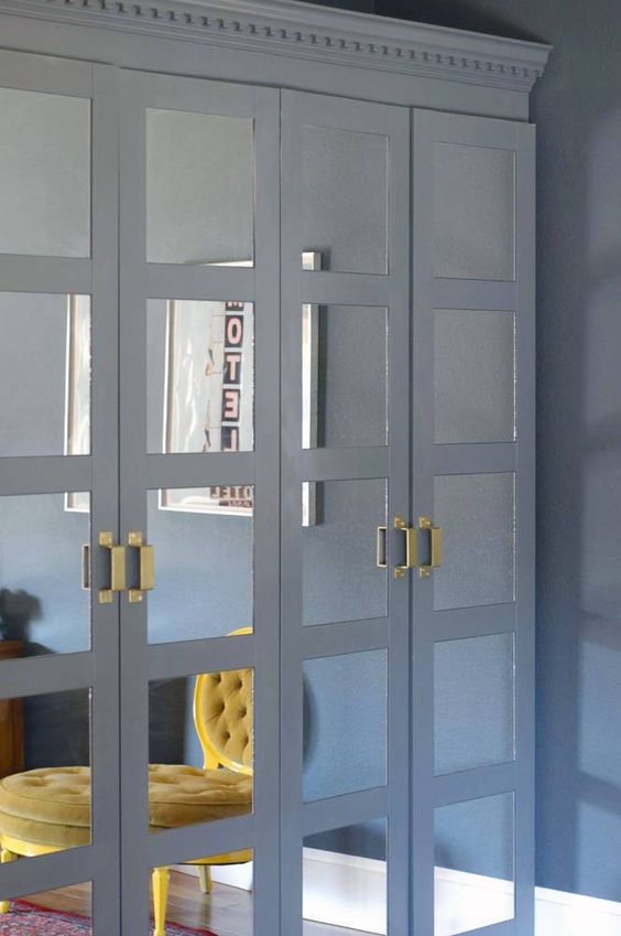 slate grey framed mirrored doors plus geometric brass handles for a contrasting and eye-catchy look