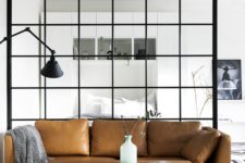 03 a Stockholm sofa in tan leather looks ideal in a light-filled Scandinavian space