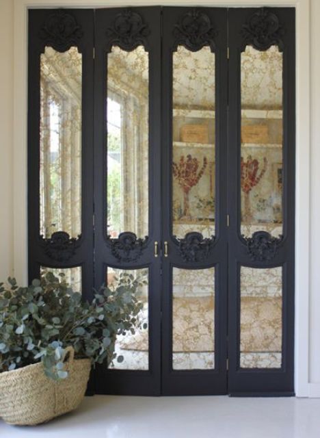 refined black frame mirror doors with exquisite detailing is a chic idea for a Pax wardrobe