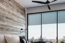 05 this rustic masculine space features a glazed wall with views of the city